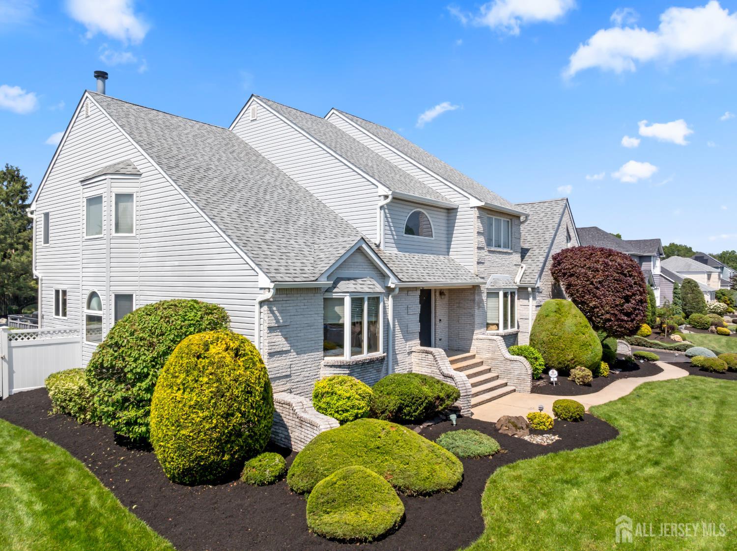 6 Allison Court Edison, NJ 08820 - Photo 2 of 53 a front view of a house with garden