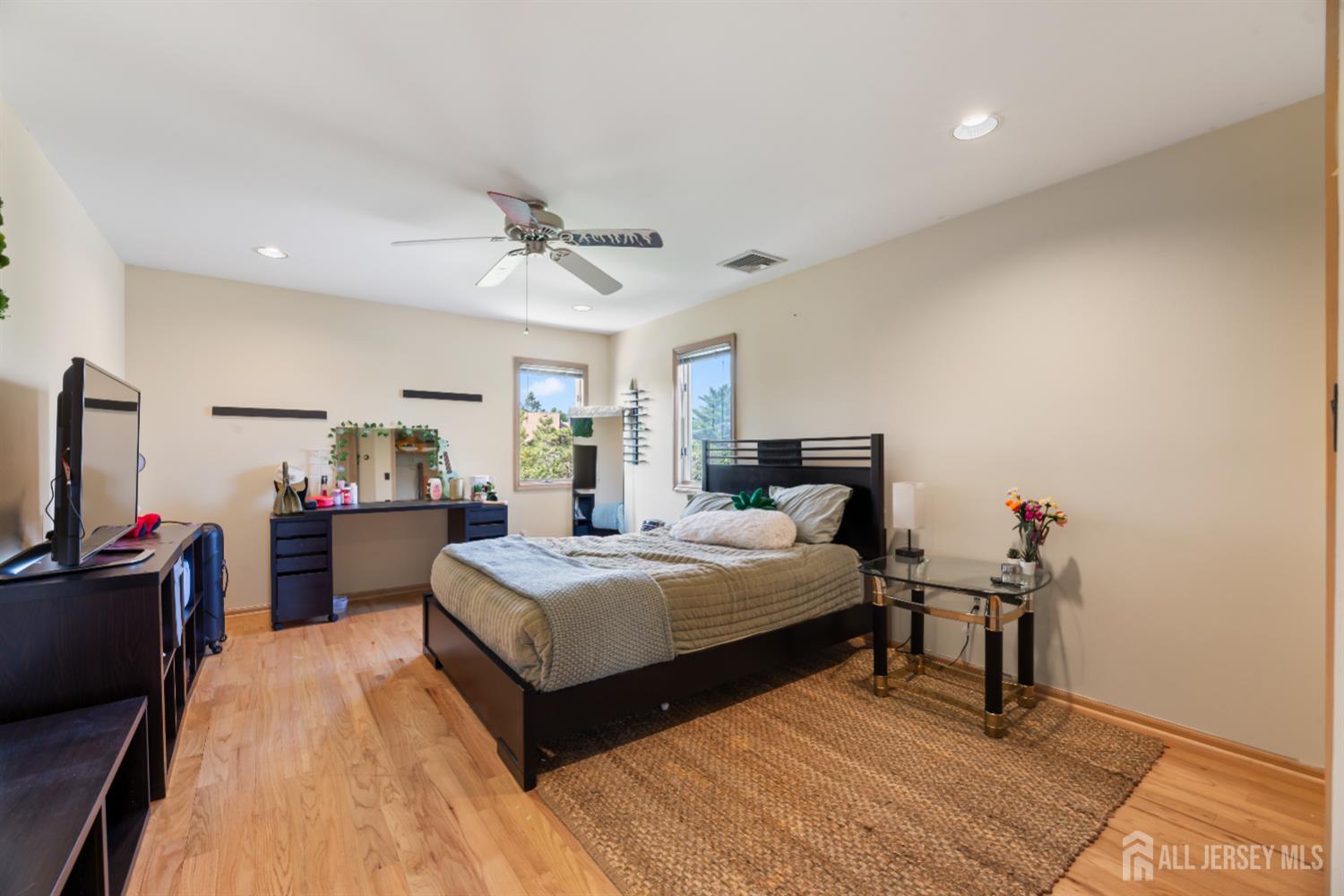 6 Allison Court Edison, NJ 08820 - Photo 25 of 53 a bedroom with a bed and a flat screen tv
