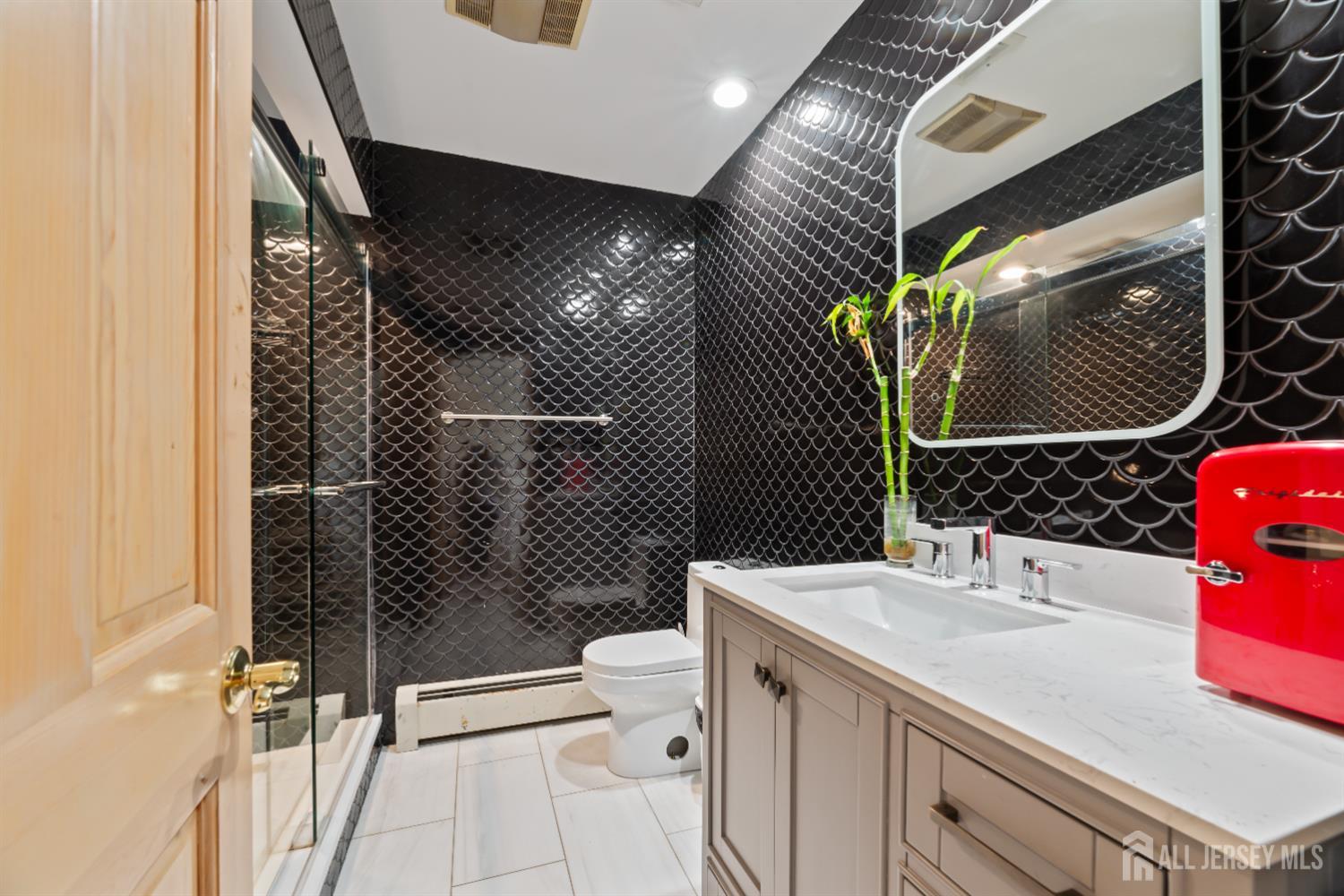 6 Allison Court Edison, NJ 08820 - Photo 26 of 53 a bathroom with a sink toilet and shower