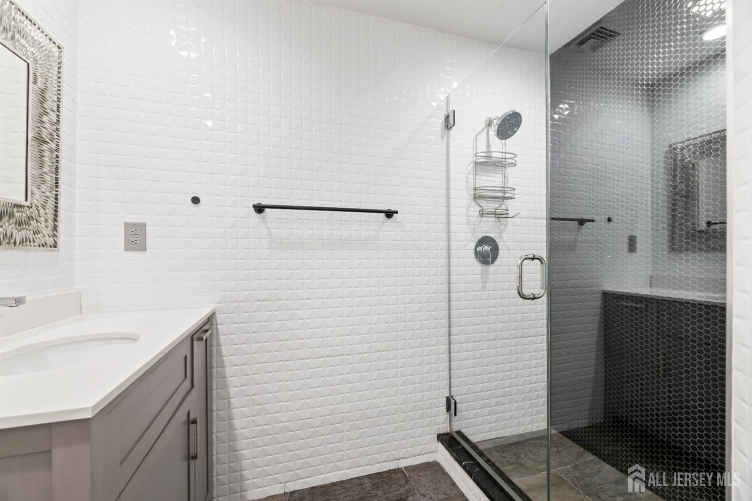 6 Allison Court Edison, NJ 08820 - Photo 30 of 53 a bathroom with a shower sink and mirror