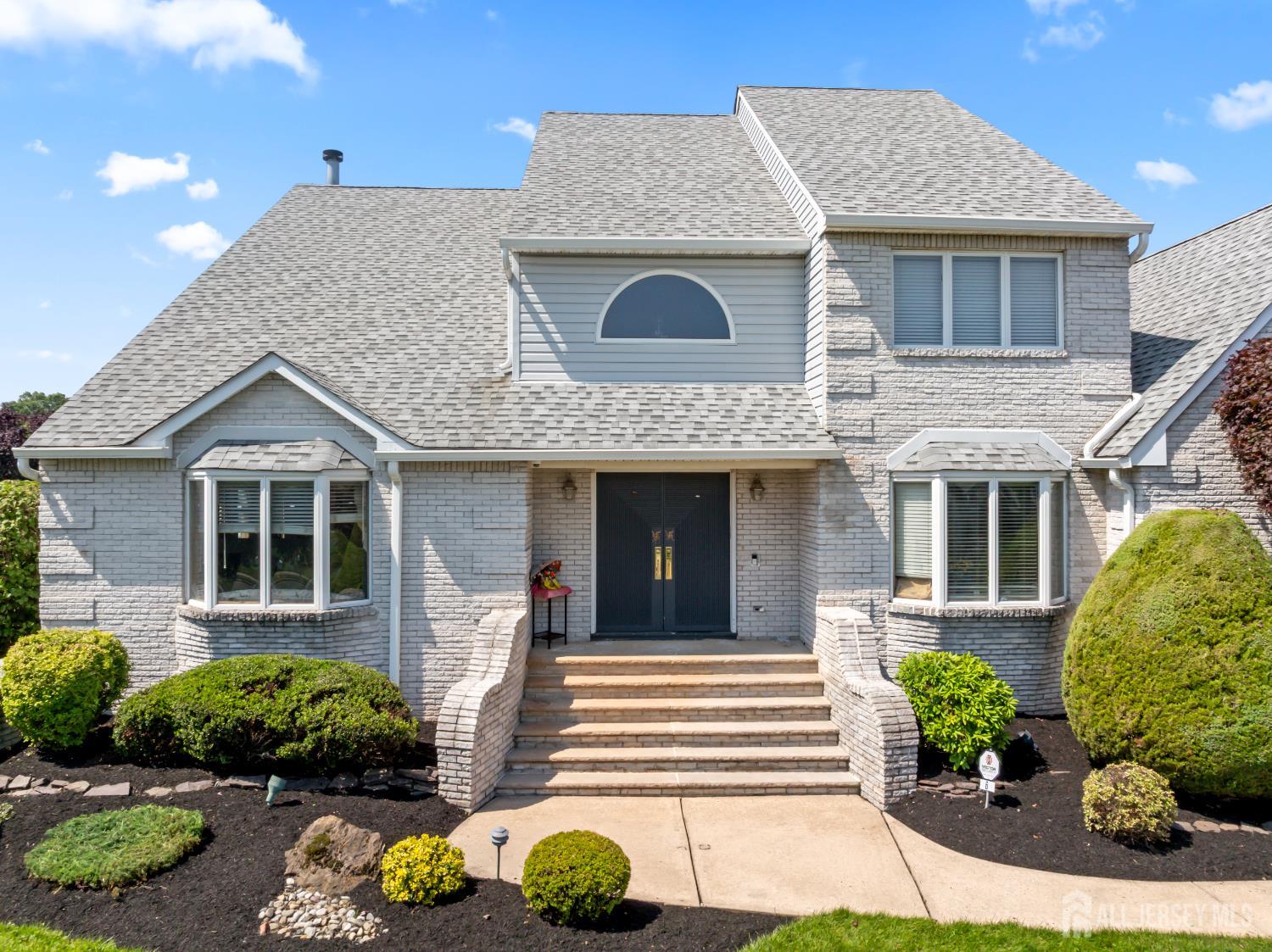 6 Allison Court Edison, NJ 08820 - Photo 3 of 53 a front view of a house with a yard