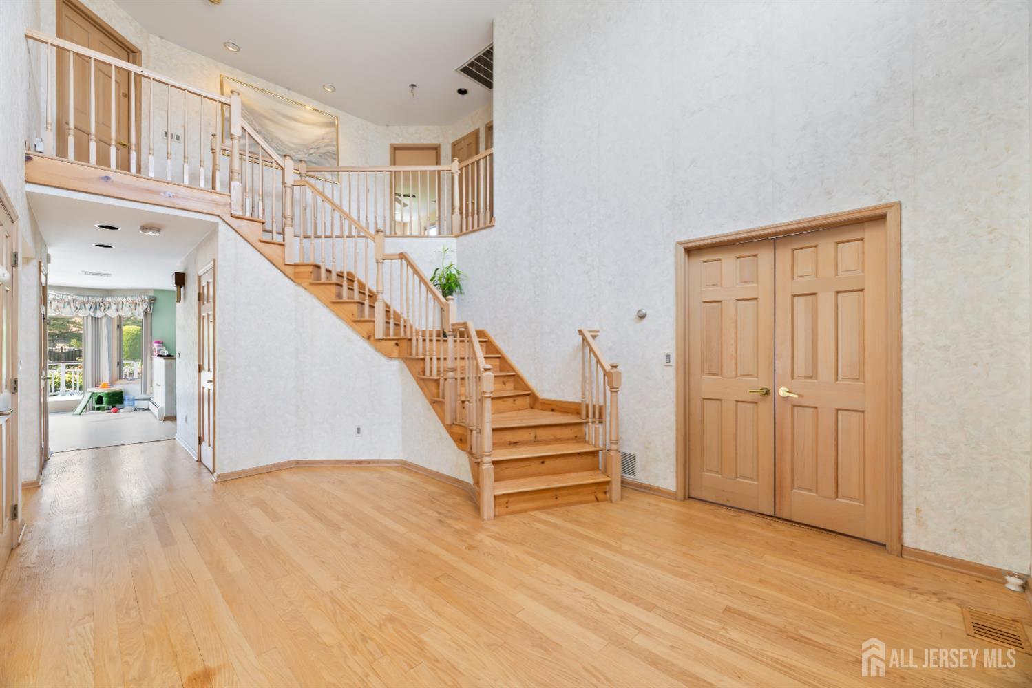 6 Allison Court Edison, NJ 08820 - Photo 4 of 53 a view of entryway and hall with wooden floor