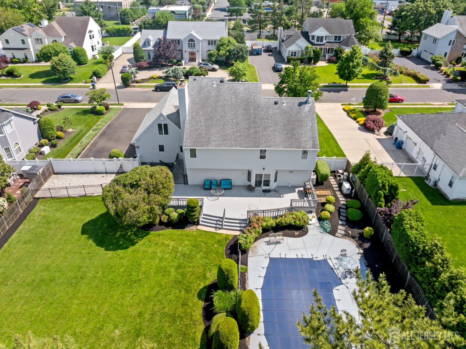 6 Allison Court Edison, NJ 08820 - Photo 43 of 53 an aerial view of a house with swimming pool outdoor seating and yard