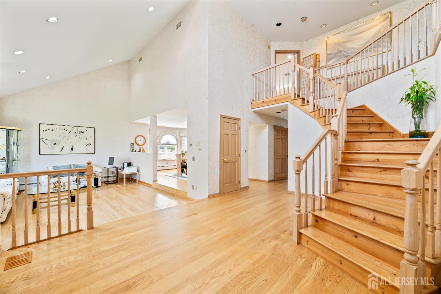 6 Allison Court Edison, NJ 08820 - Photo 6 of 53 a view of entryway and hall with wooden floor