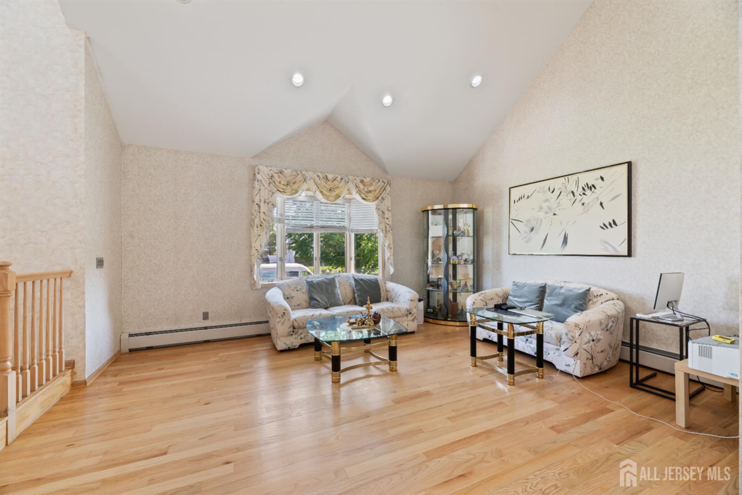 6 Allison Court Edison, NJ 08820 - Photo 7 of 53 a living room with furniture and a large window