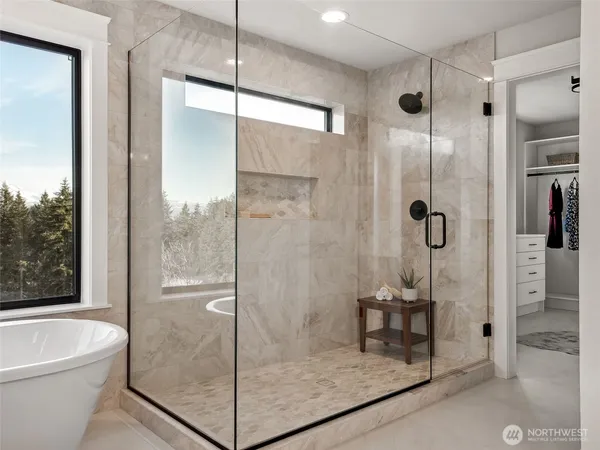 a bathroom with a shower and bathtub
