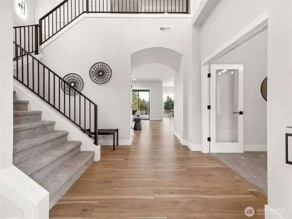 a view of an entryway with wooden floor