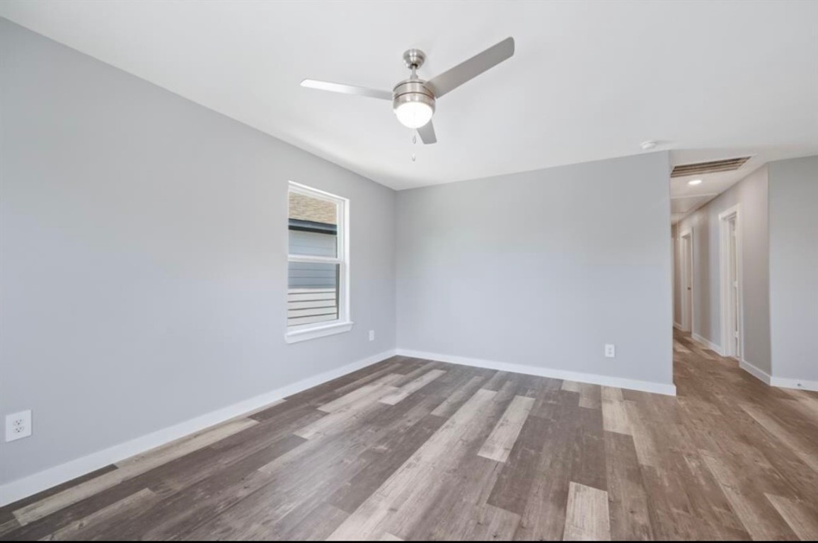 622 Maple Way Houston, TX 77015 - Photo 3 of 23 wooden floor in an empty room with a window