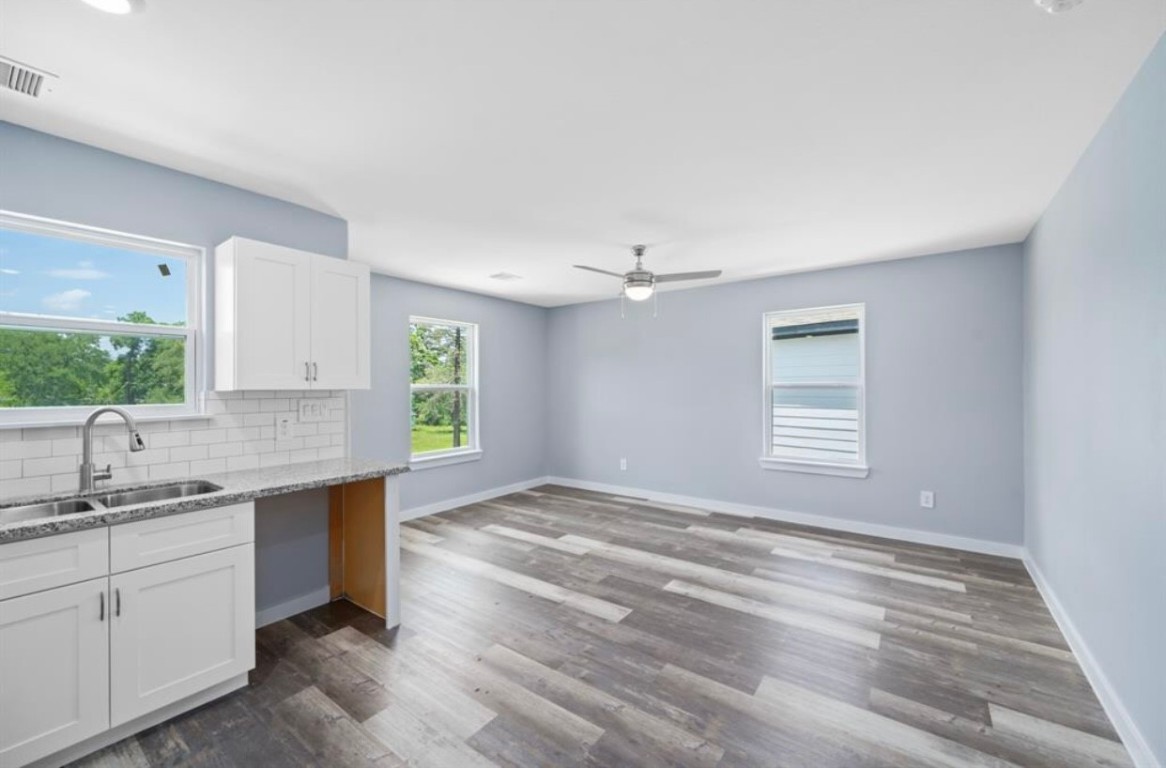 622 Maple Way Houston, TX 77015 - Photo 8 of 23 a kitchen with a sink cabinets appliances and a window