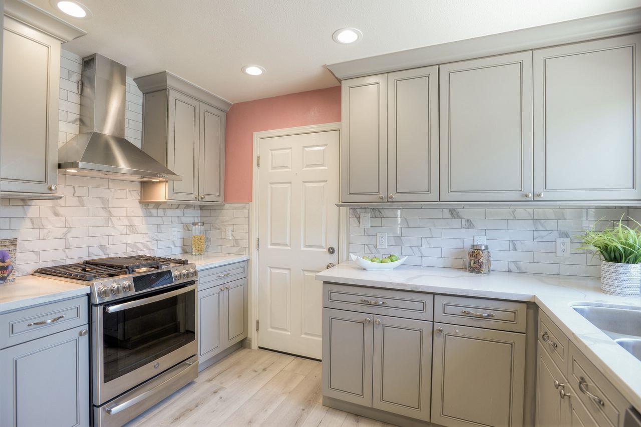 15 Robert Place Millbrae, CA 94030 - Photo 12 of 30 a kitchen with stainless steel appliances granite countertop a sink stove and cabinets
