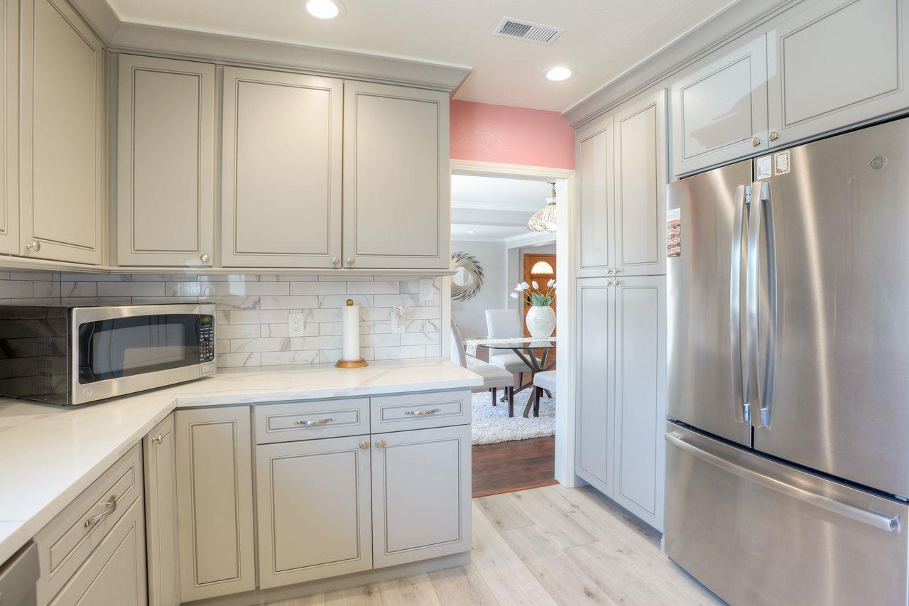 15 Robert Place Millbrae, CA 94030 - Photo 13 of 30 a kitchen with white cabinets and refrigerator