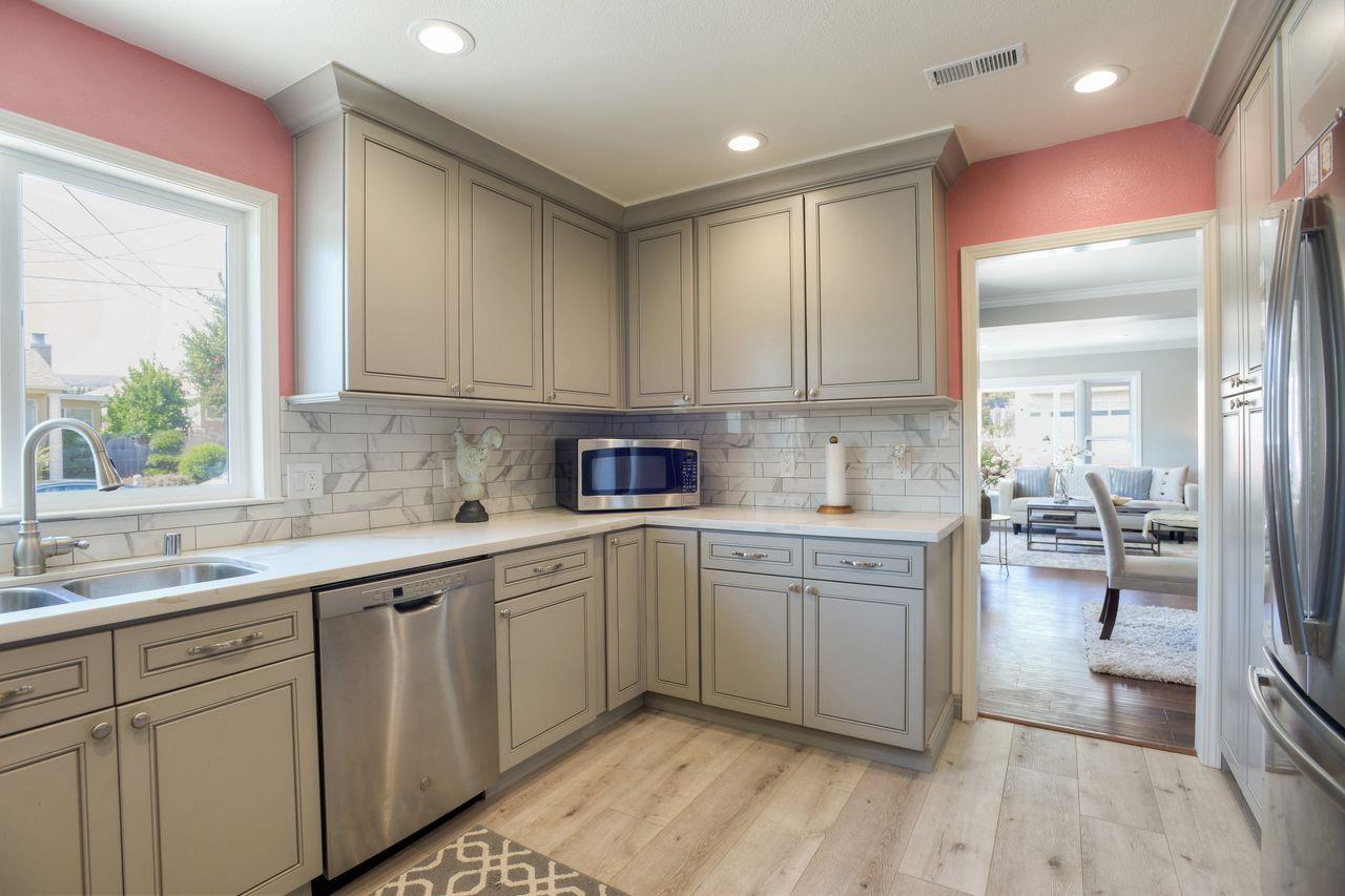 15 Robert Place Millbrae, CA 94030 - Photo 15 of 30 a kitchen with a sink cabinets and window
