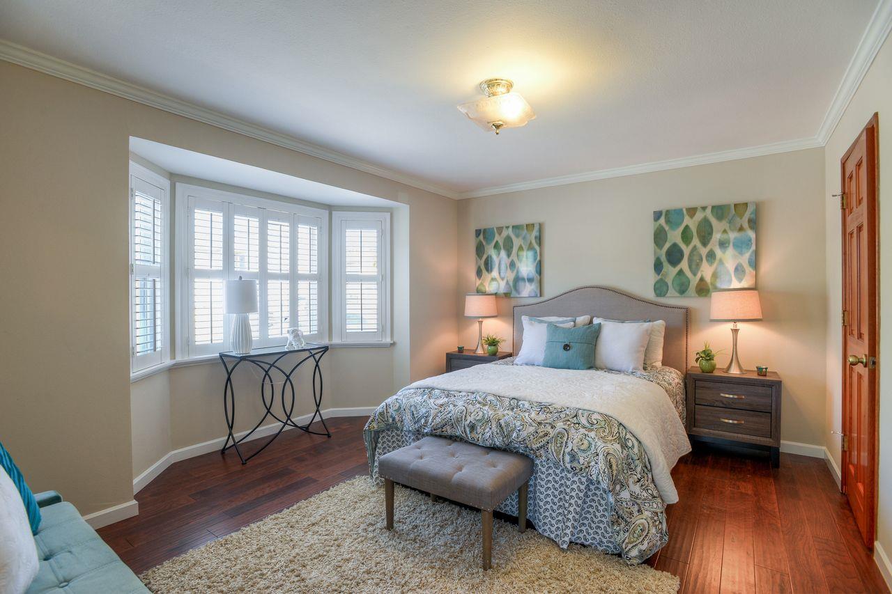 15 Robert Place Millbrae, CA 94030 - Photo 18 of 30 a bedroom with a bed and a table in it