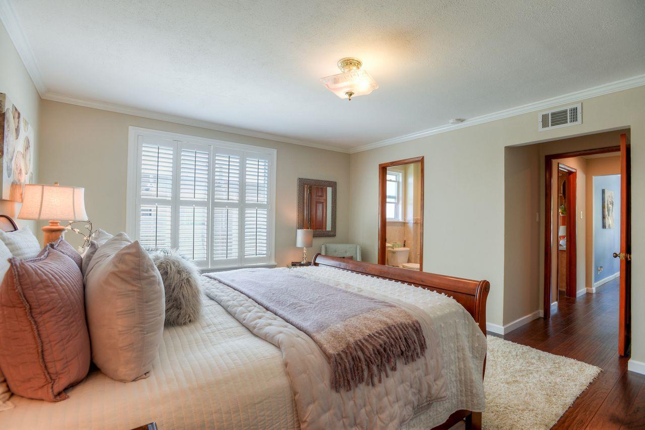 15 Robert Place Millbrae, CA 94030 - Photo 23 of 30 a spacious bedroom with a large bed and a window