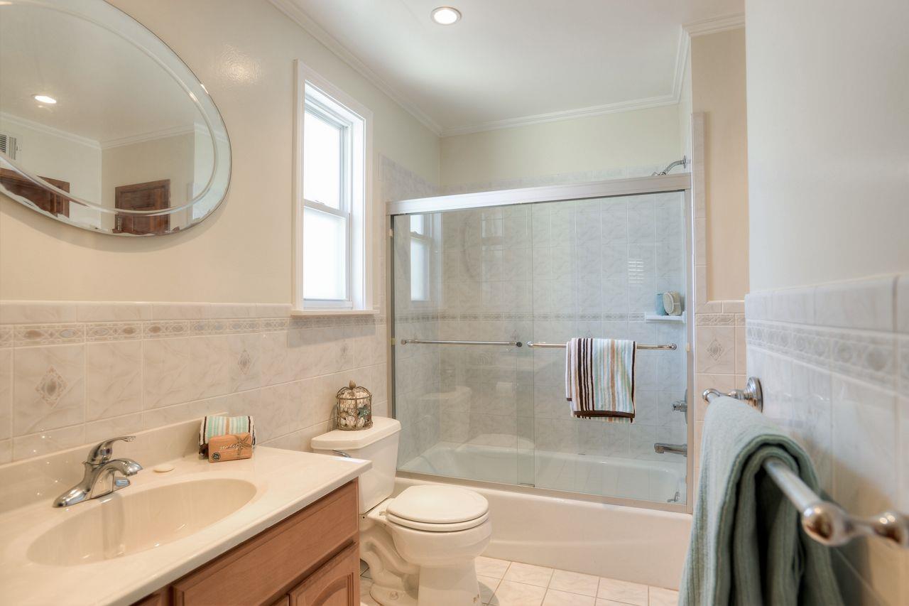 15 Robert Place Millbrae, CA 94030 - Photo 27 of 30 a bathroom with a sink a toilet and a mirror