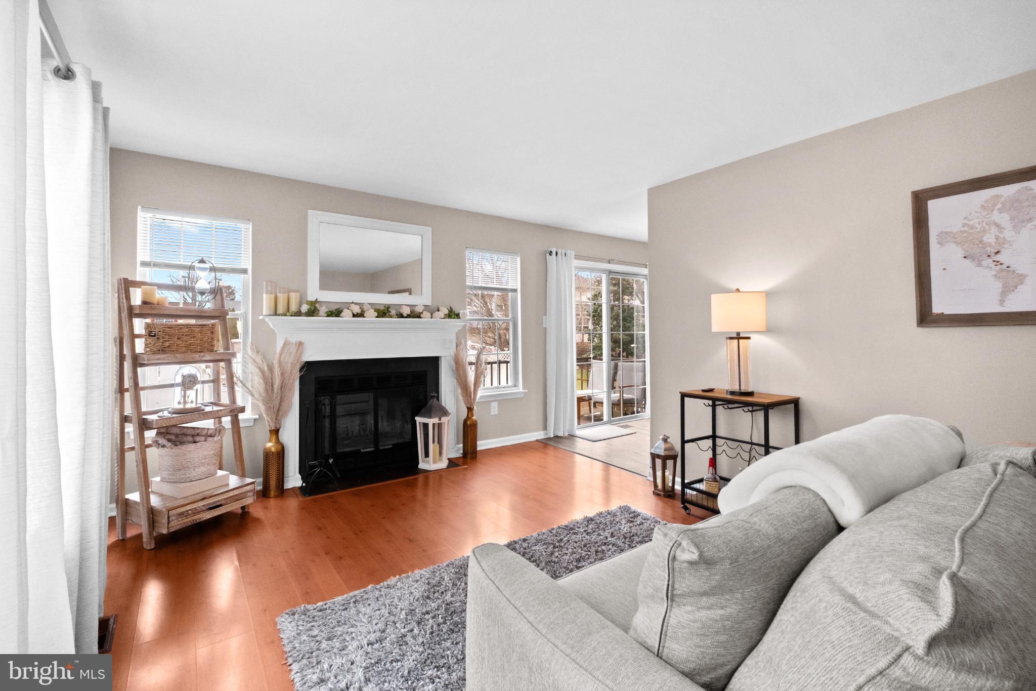 210 Martins Way Mount Laurel, NJ 08054 - Photo 10 of 38 a living room with furniture and a fireplace