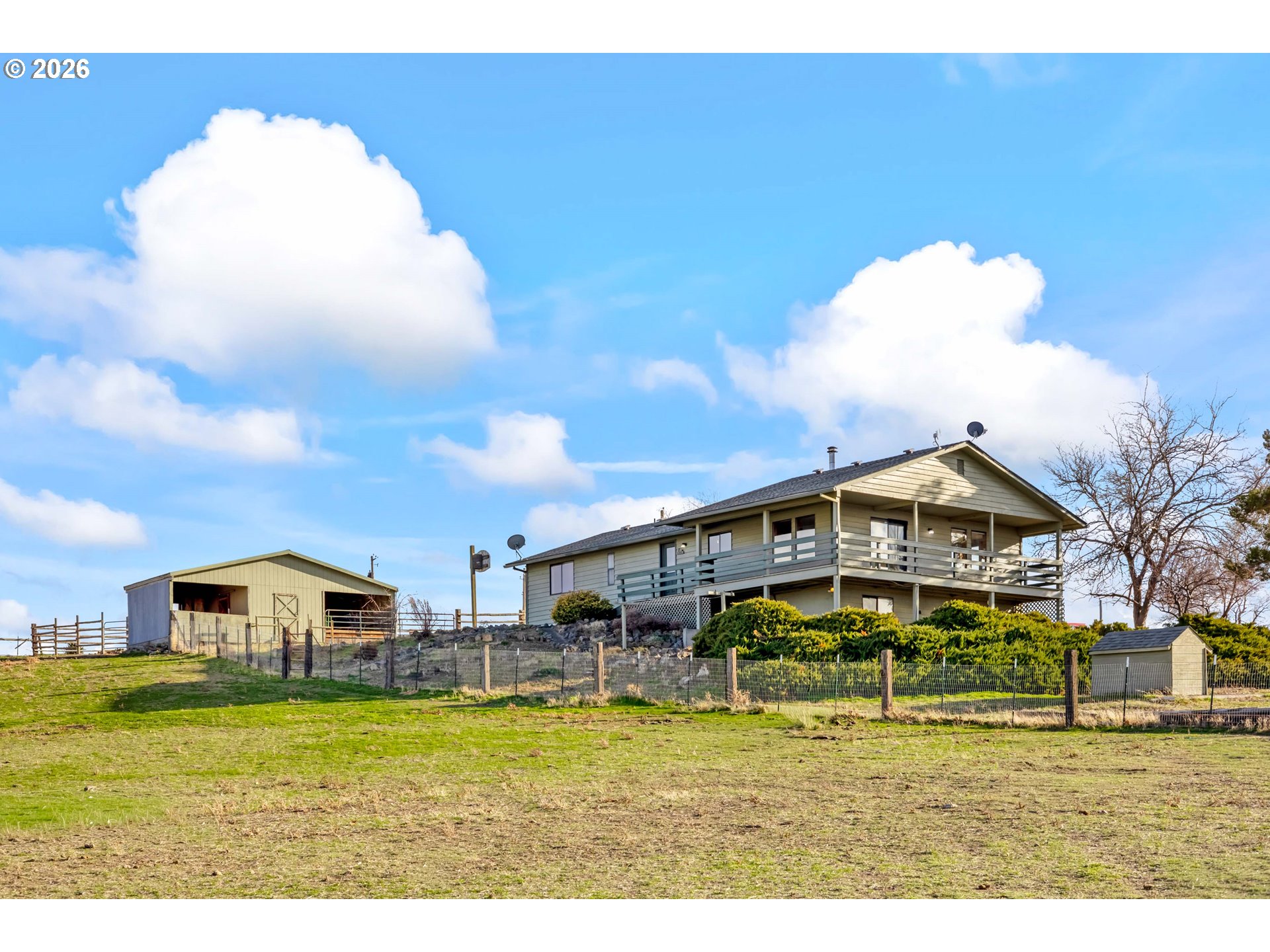 896 Southeast Dover Lane Madras, OR 97741 - Photo 1 of 44 a front view of a house with a yard