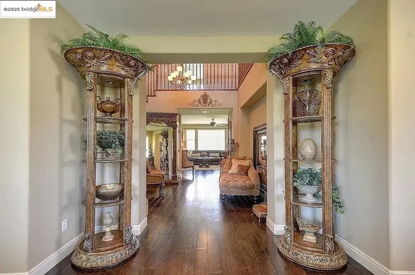 a view of a living room and hardwood floor