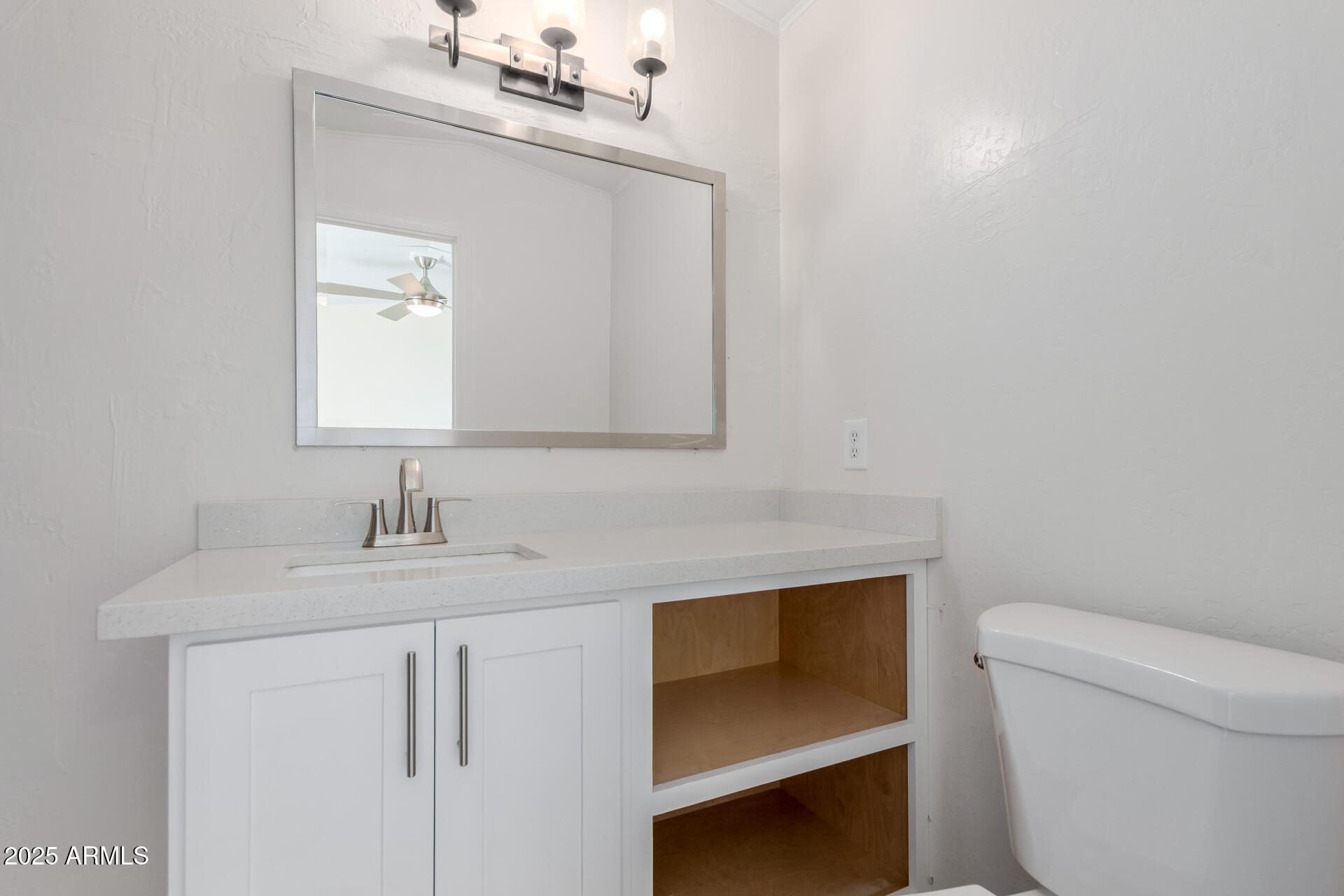 2000 South Apache Road, Unit 276 Buckeye, AZ 85326 - Photo 13 of 27 a bathroom with a sink vanity and toilet