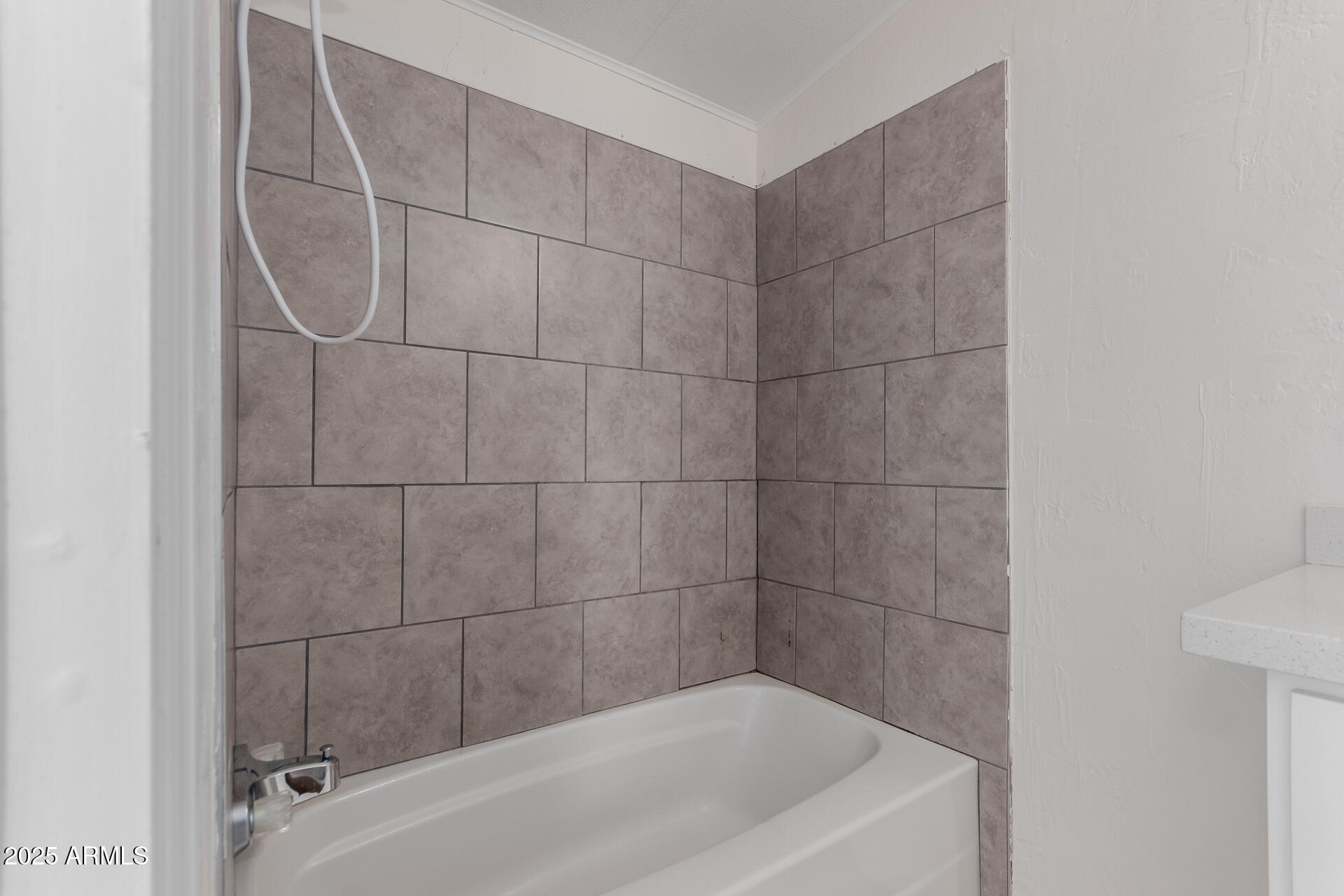 2000 South Apache Road, Unit 276 Buckeye, AZ 85326 - Photo 14 of 27 a bathroom with a bathtub