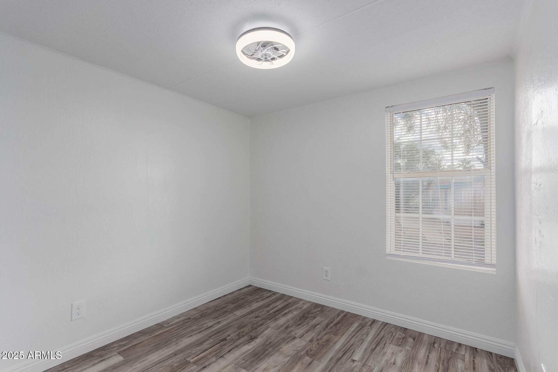 2000 South Apache Road, Unit 276 Buckeye, AZ 85326 - Photo 16 of 27 an empty room with a window