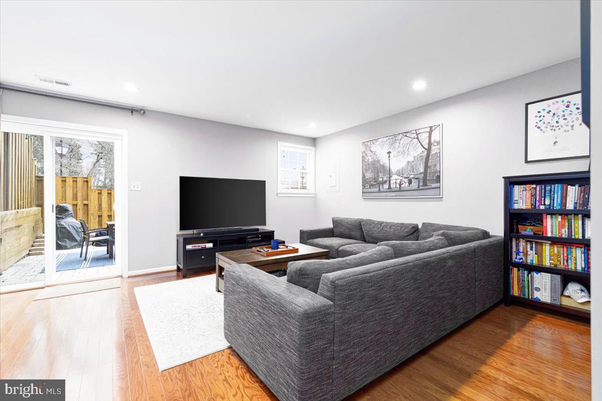 2049 South Glebe Road Arlington, VA 22206 - Photo 15 of 25 a living room with furniture and a flat screen tv