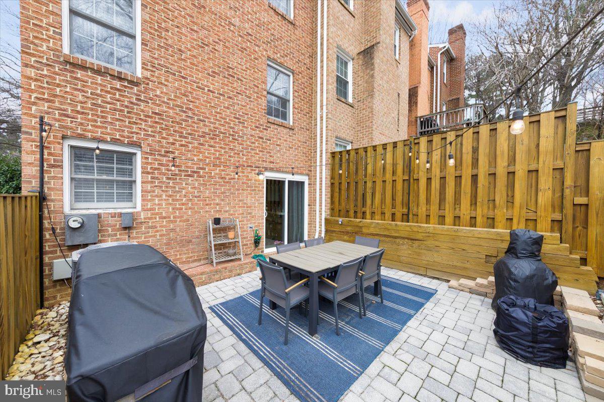 2049 South Glebe Road Arlington, VA 22206 - Photo 19 of 25 a view of a patio with a dining table and chairs
