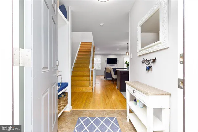 a kitchen with a refrigerator and a stove top oven