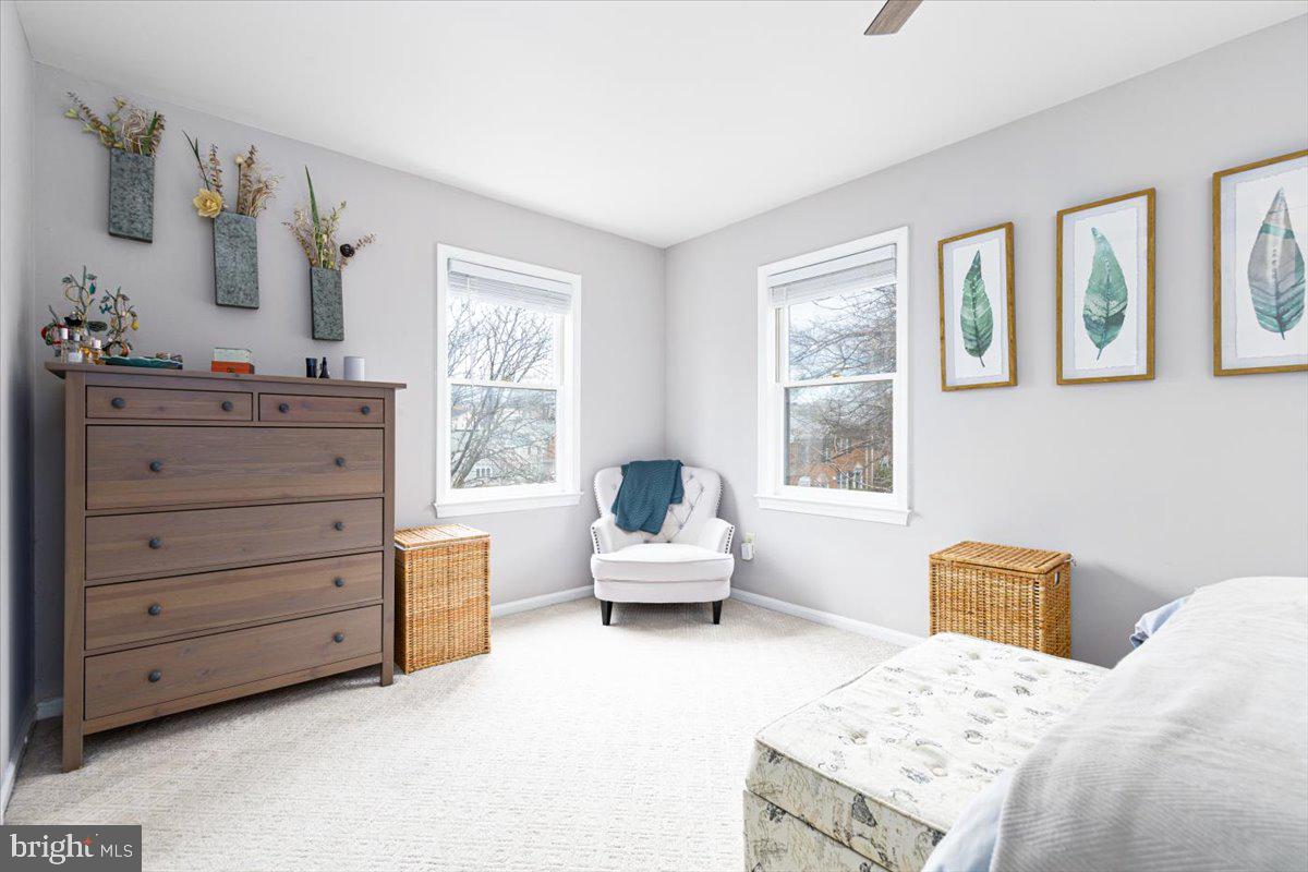 2049 South Glebe Road Arlington, VA 22206 - Photo 10 of 25 a bedroom with a bed and wooden floor