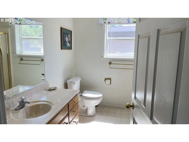 a open area with a sink and a mirror