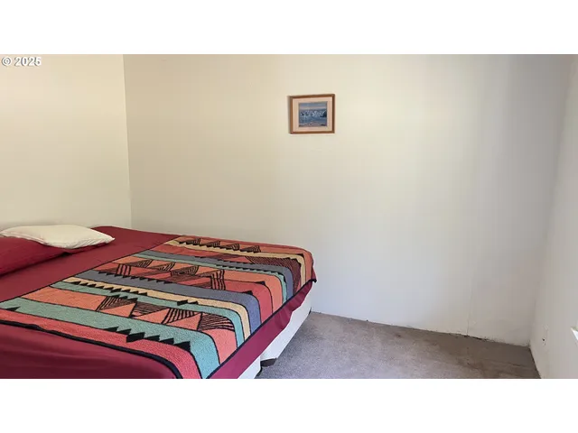 a living room with furniture and a walk in closet