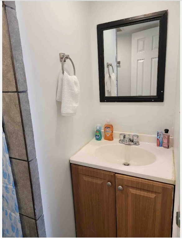 8041 Howard Drive, Unit 2 Houston, TX 77017 - Photo 3 of 6 a bathroom with a sink vanity and a mirror