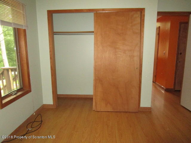 5687 Decker Road Bushkill, PA 18324 - Photo 5 of 8 an empty room with windows