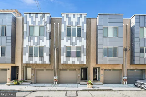 a front view of a building with a street