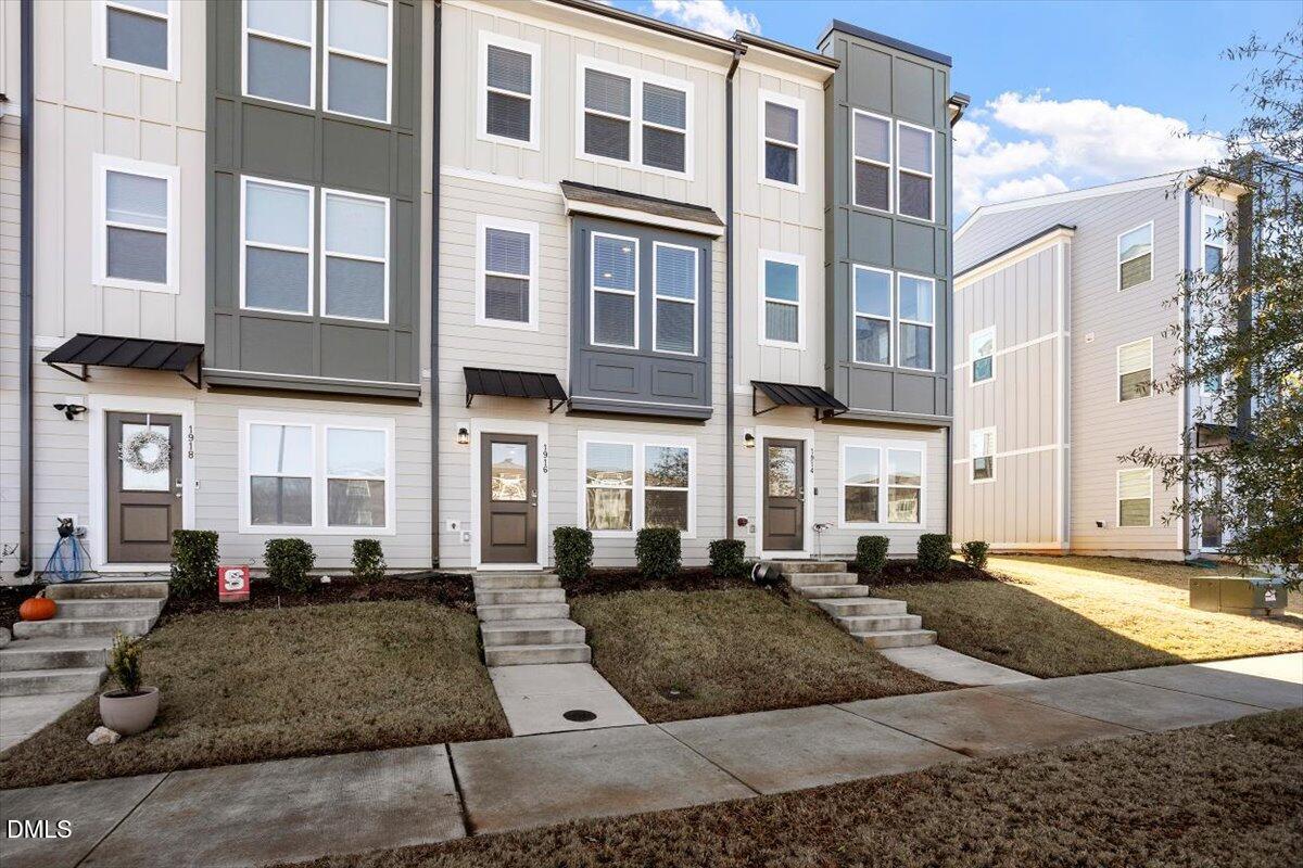 a view of a building with a yard