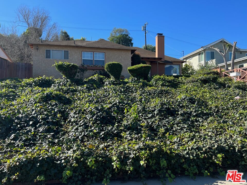 5280 Sanchez Drive Los Angeles, CA 90008 - Photo 2 of 30 a front view of a house with garden