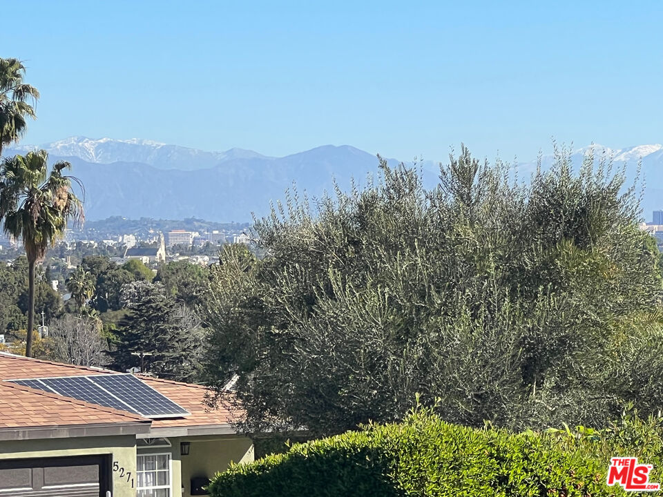 5280 Sanchez Drive Los Angeles, CA 90008 - Photo 28 of 30 a view of house with green field and mountains