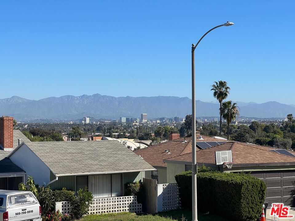 5280 Sanchez Drive Los Angeles, CA 90008 - Photo 5 of 30 a view of a terrace with a garden and lawn chairs