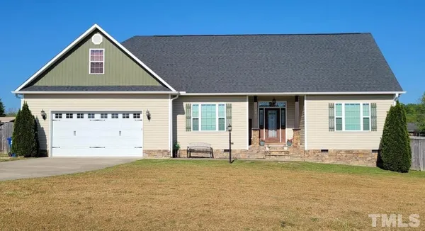 a view of a house with large windows