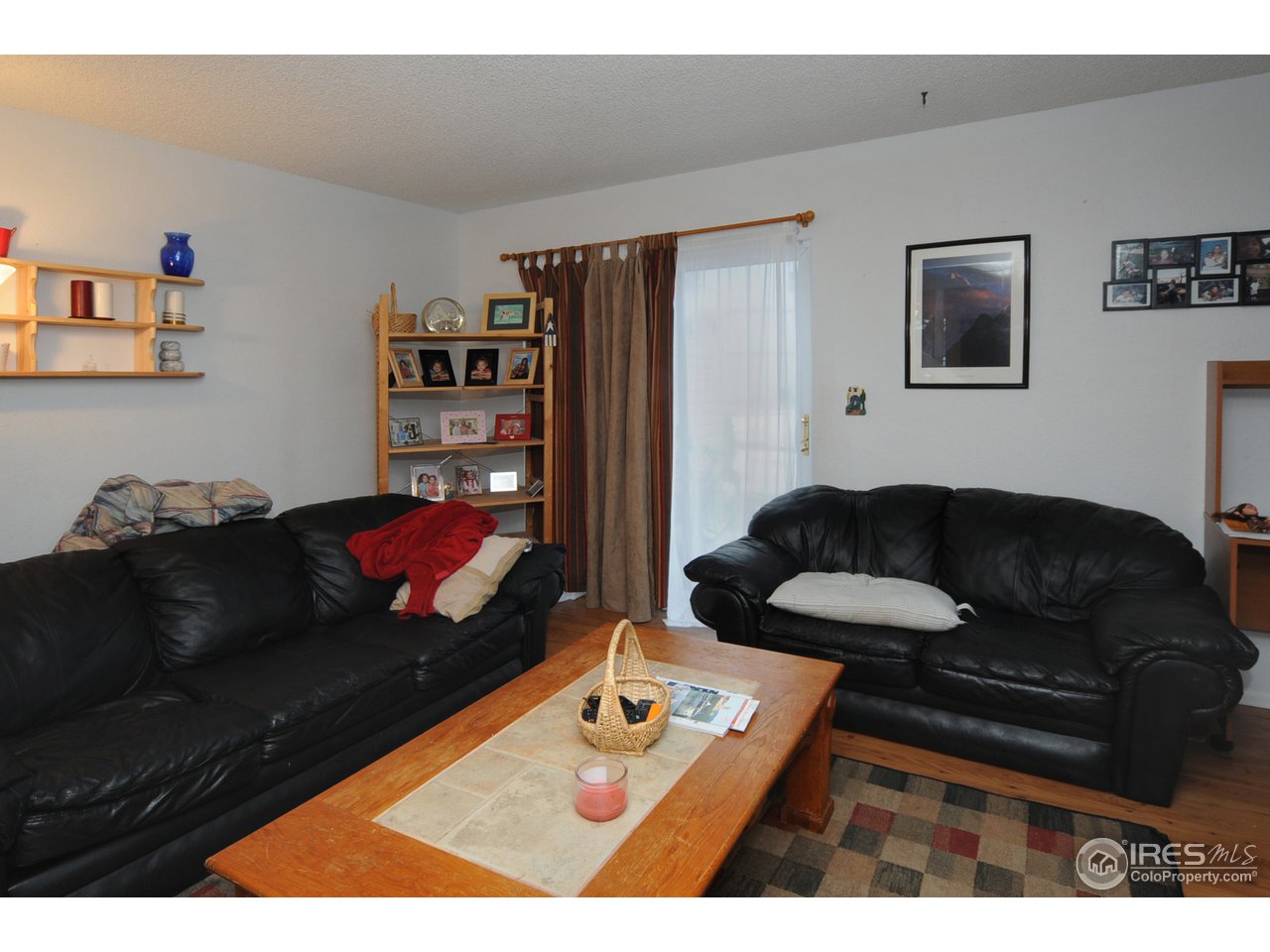 1705 Heatheridge Road, Unit L105 Fort Collins, CO 80526 - Photo 2 of 9 a living room with furniture and a couch