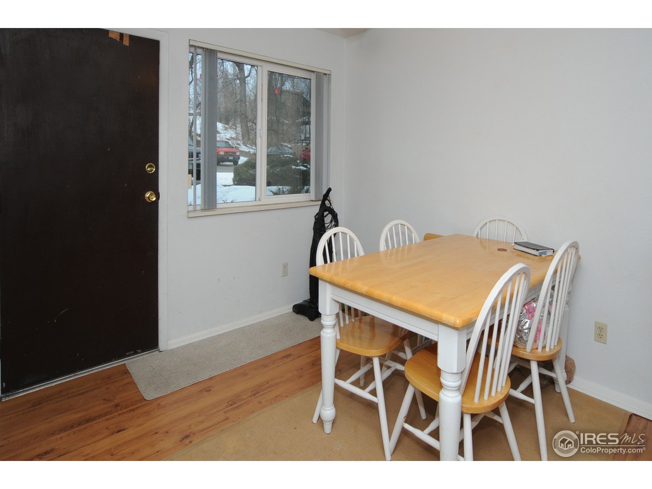 1705 Heatheridge Road, Unit L105 Fort Collins, CO 80526 - Photo 7 of 9 a view of a dining room with furniture and window