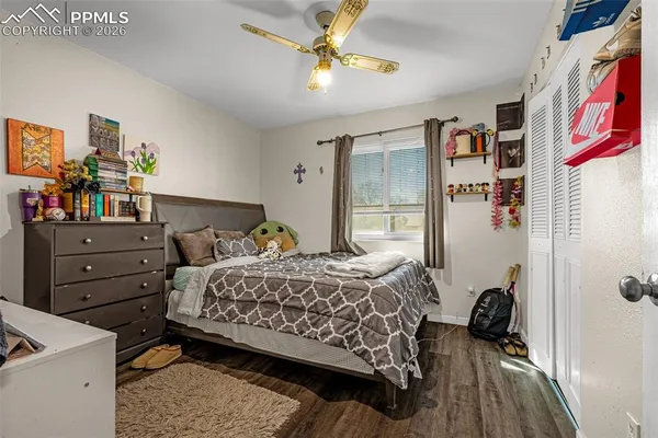 a bedroom with a bed and a dresser