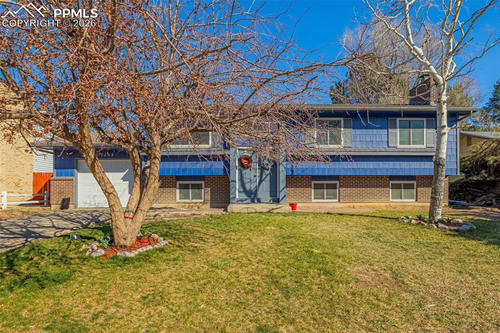 7045 Roaring Spring Terrace Fountain, CO 80817 - Photo 2 of 45 a house view with a garden space