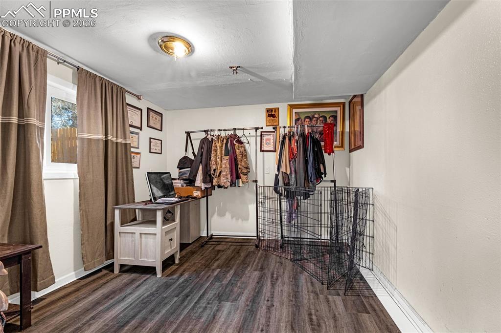 7045 Roaring Spring Terrace Fountain, CO 80817 - Photo 23 of 45 a view of a walk in closet with clothes and shoes