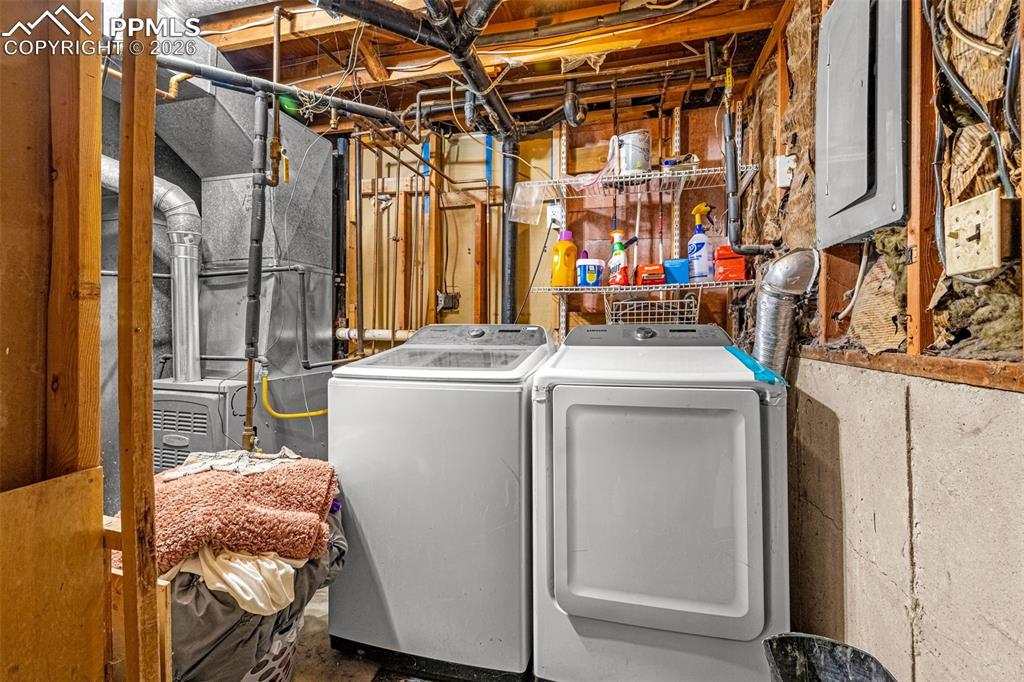 7045 Roaring Spring Terrace Fountain, CO 80817 - Photo 24 of 45 a utility room with dryer and washer