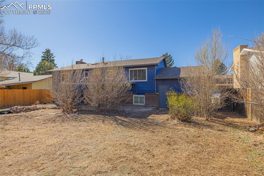 7045 Roaring Spring Terrace Fountain, CO 80817 - Photo 30 of 45 a view of a house with a yard