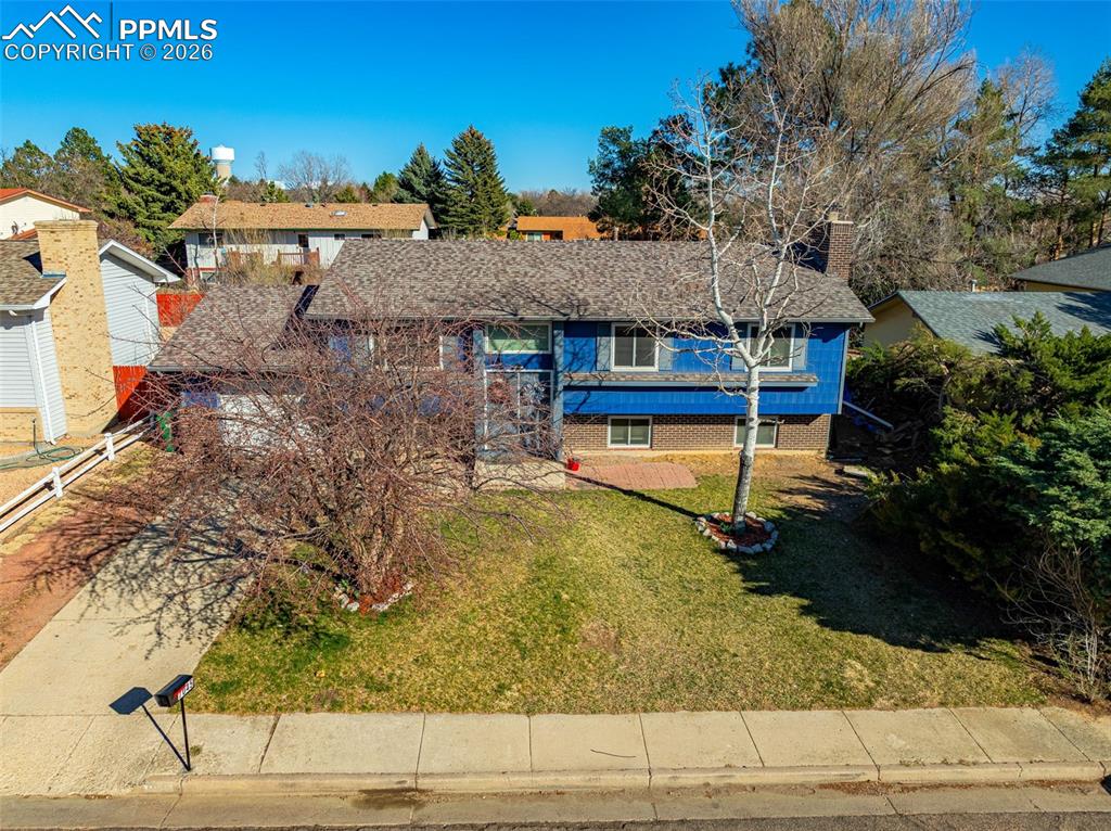 7045 Roaring Spring Terrace Fountain, CO 80817 - Photo 36 of 45 a view of a house with a yard