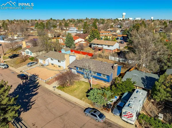 an aerial view of residential houses with outdoor space