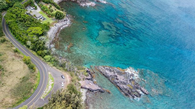 a view of a swimming pool with a yard