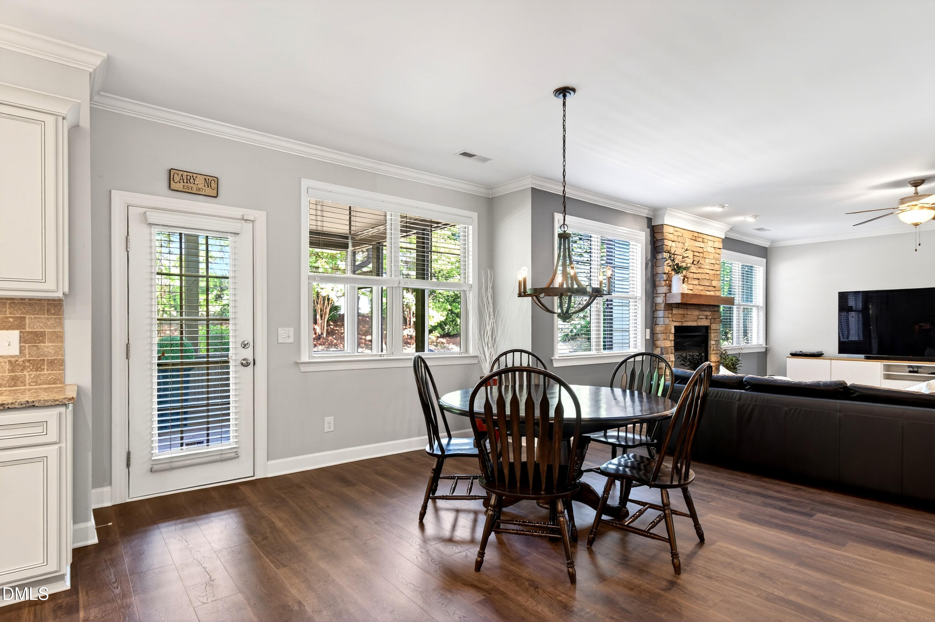313 Karpen Lane Cary, NC 27519 - Photo 25 of 86 a view of a dining room with furniture window and wooden floor
